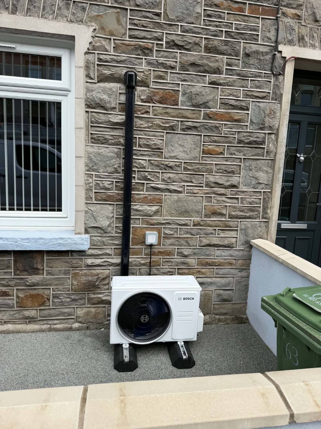 Bosch outdoor unit on a stone terraced house